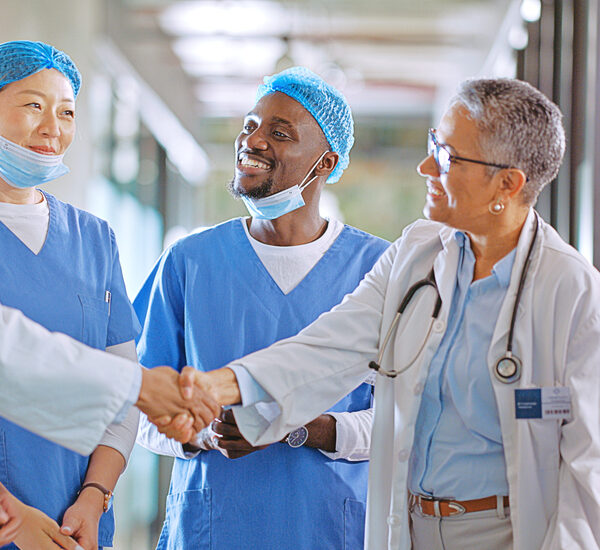 Healthcare-professionalshaking-hands-William-Russell